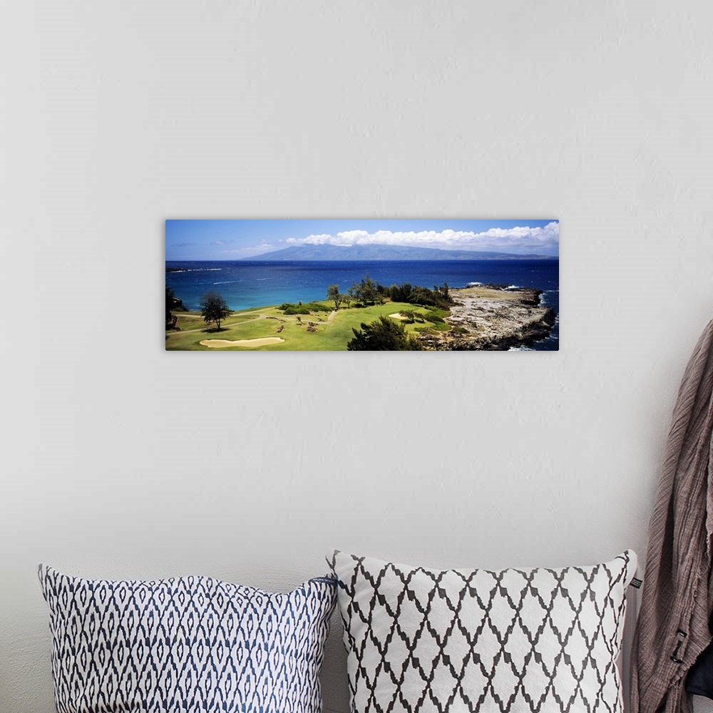A bohemian room featuring Big horizontal panoramic photograph of a golf course by the ocean in Maui, Hawaii (HI).