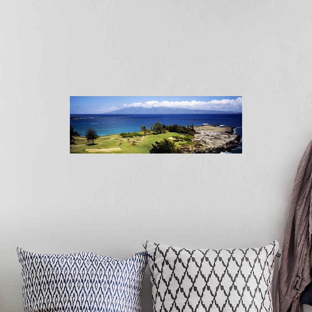A bohemian room featuring Big horizontal panoramic photograph of a golf course by the ocean in Maui, Hawaii (HI).
