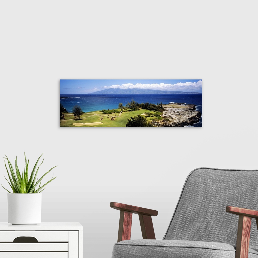 A modern room featuring Big horizontal panoramic photograph of a golf course by the ocean in Maui, Hawaii (HI).