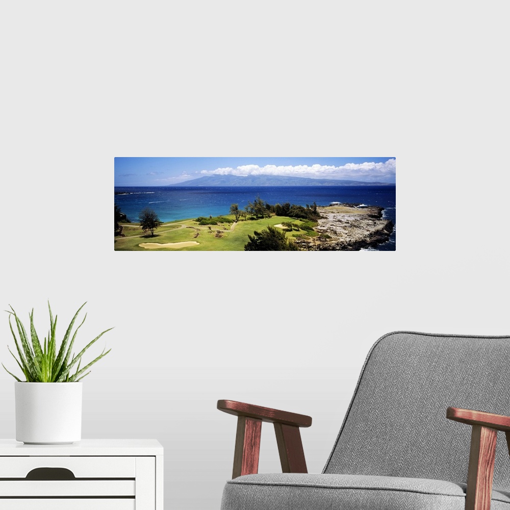 A modern room featuring Big horizontal panoramic photograph of a golf course by the ocean in Maui, Hawaii (HI).