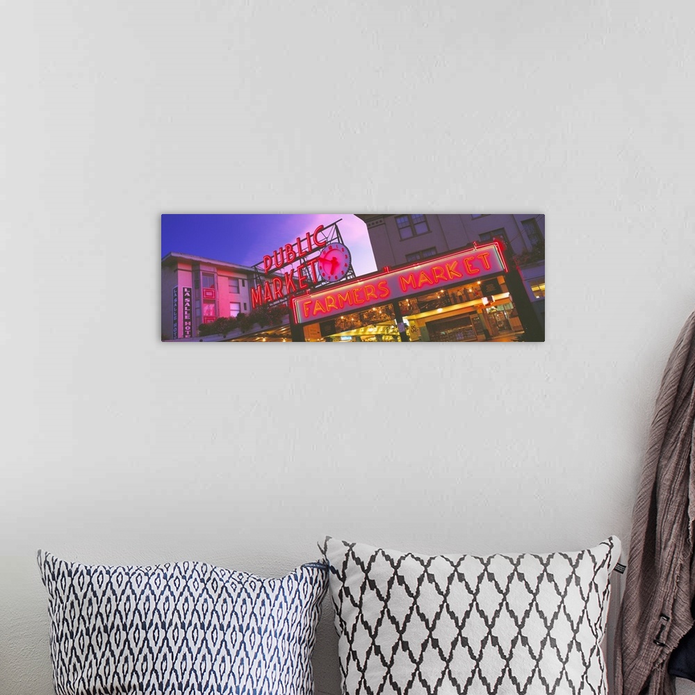 A bohemian room featuring Big, landscape photograph, taken at and angle, of the neon Public Market sign in Seattle, Washing...