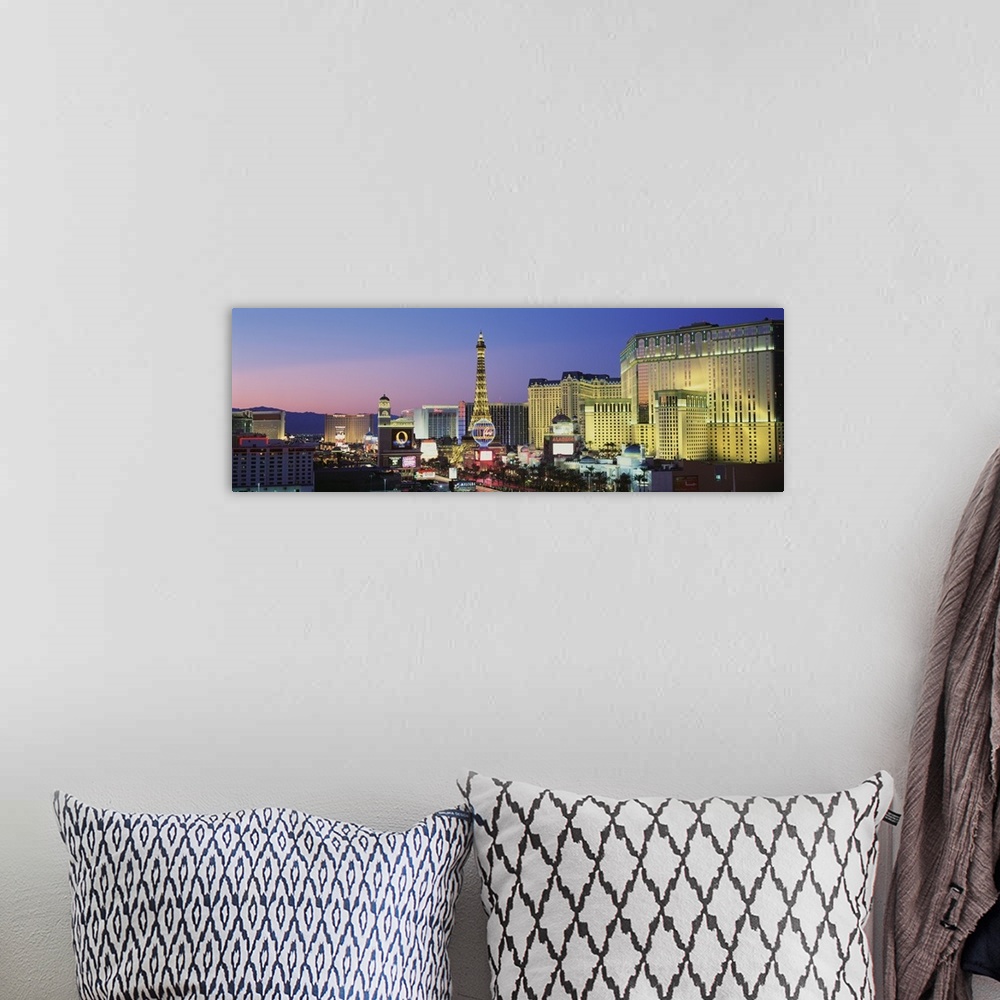 A bohemian room featuring Big panoramic canvas photo of the Las Vegas Strip illuminated at sunset.