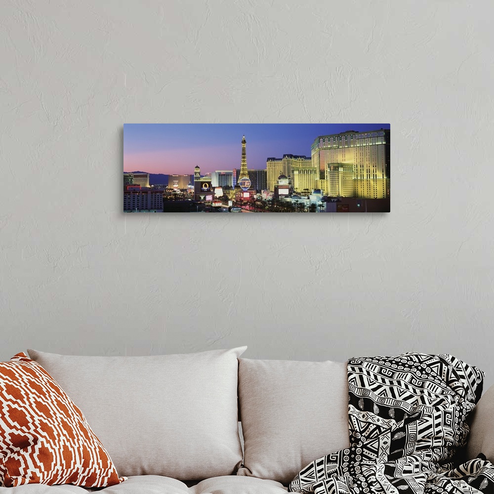 A bohemian room featuring Big panoramic canvas photo of the Las Vegas Strip illuminated at sunset.