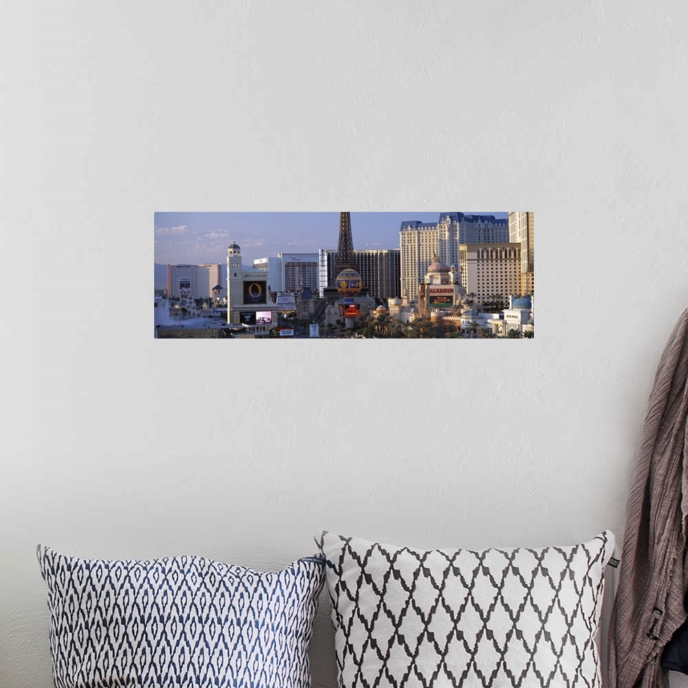 A bohemian room featuring Panoramic photograph on a large canvas of the Las Vegas strip during the day, including the Bella...