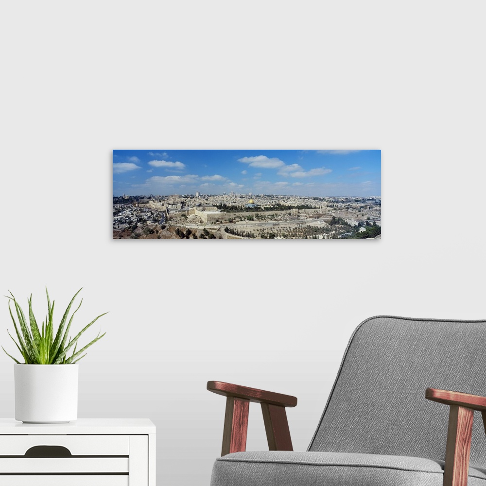 A modern room featuring Panoramic photograph of the ""Holy City"" located on a plateau in the Judean Mountains between th...