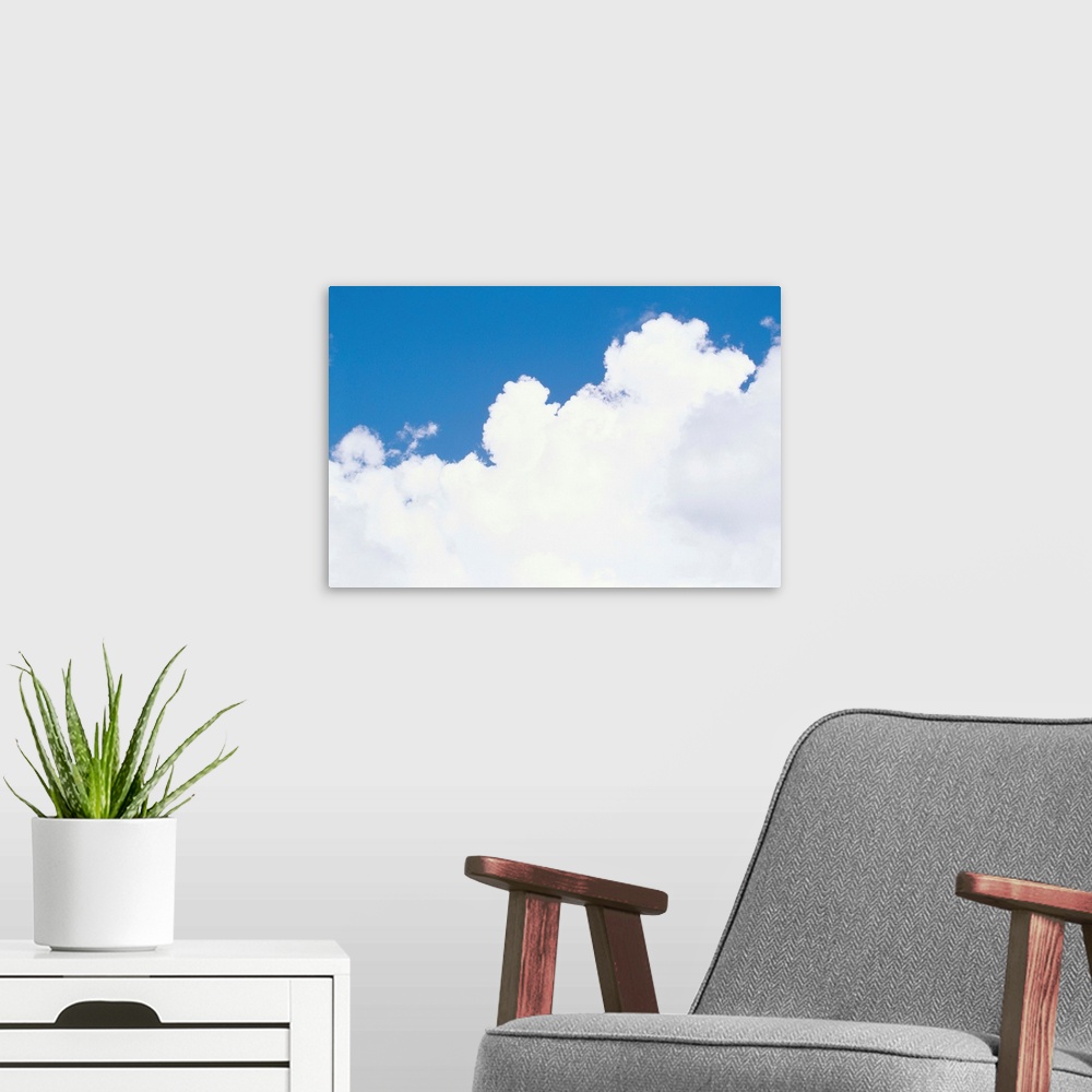 A modern room featuring Thick puffy white clouds