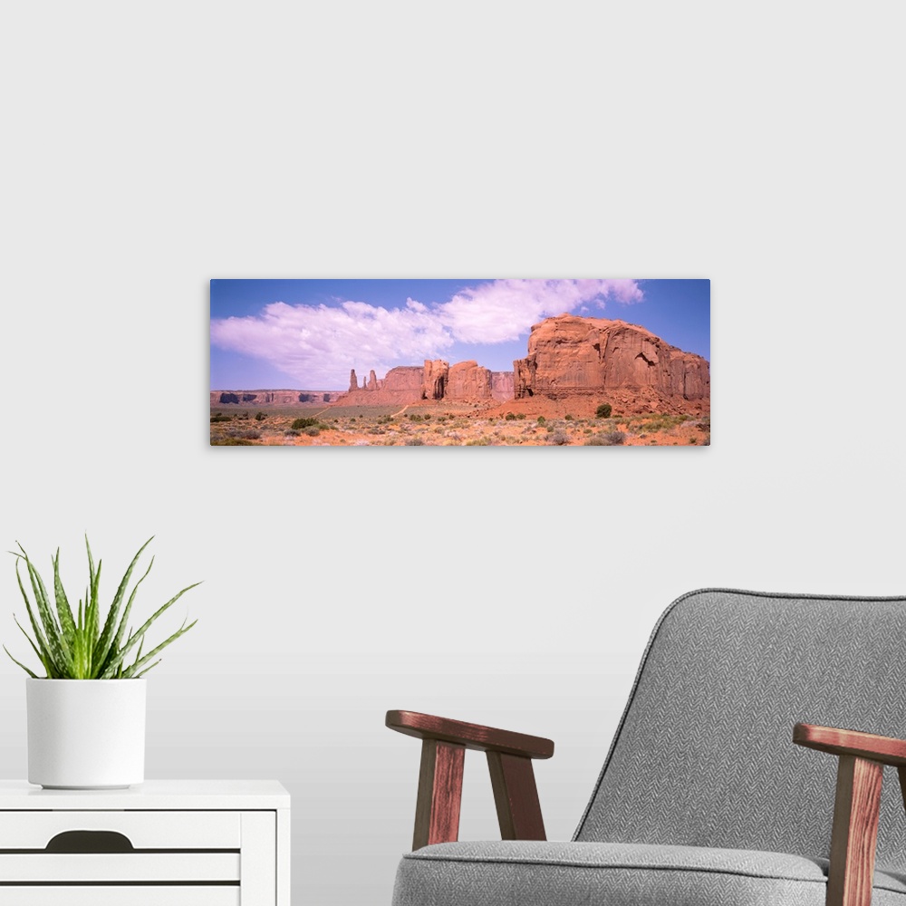 A modern room featuring Three Sisters & Camel Butte Monument Valley AZ