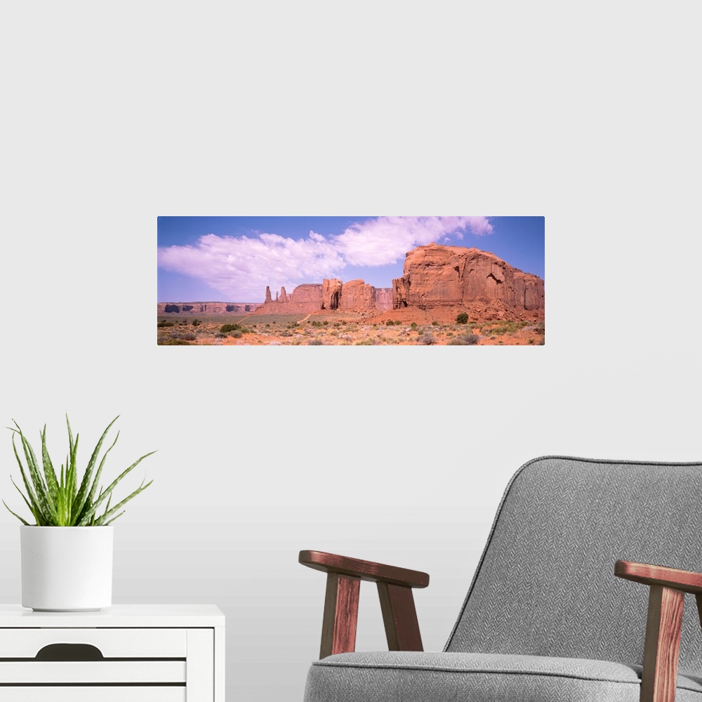 A modern room featuring Three Sisters & Camel Butte Monument Valley AZ