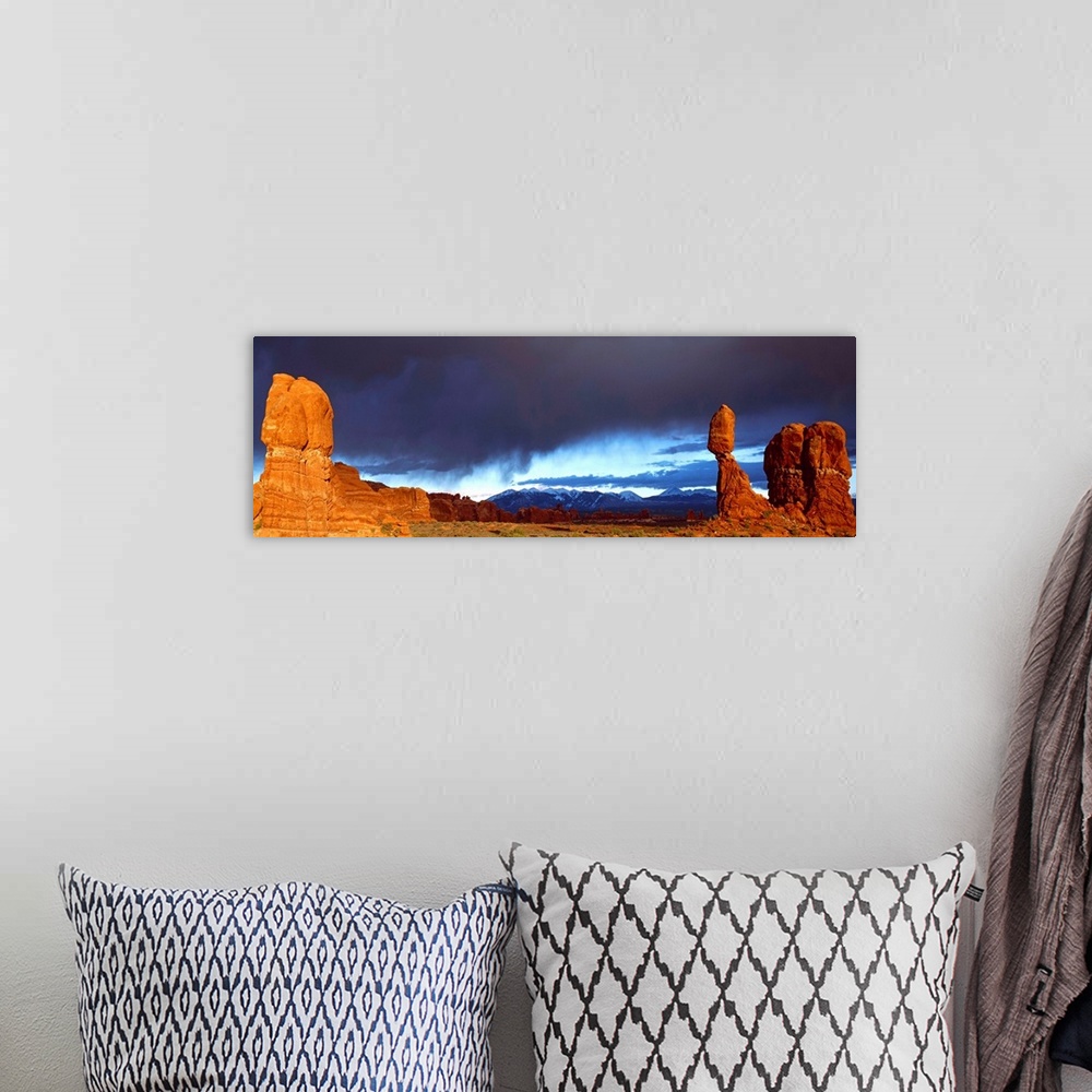 A bohemian room featuring Thunderstorm Arches National Park and Balanced Rock UT