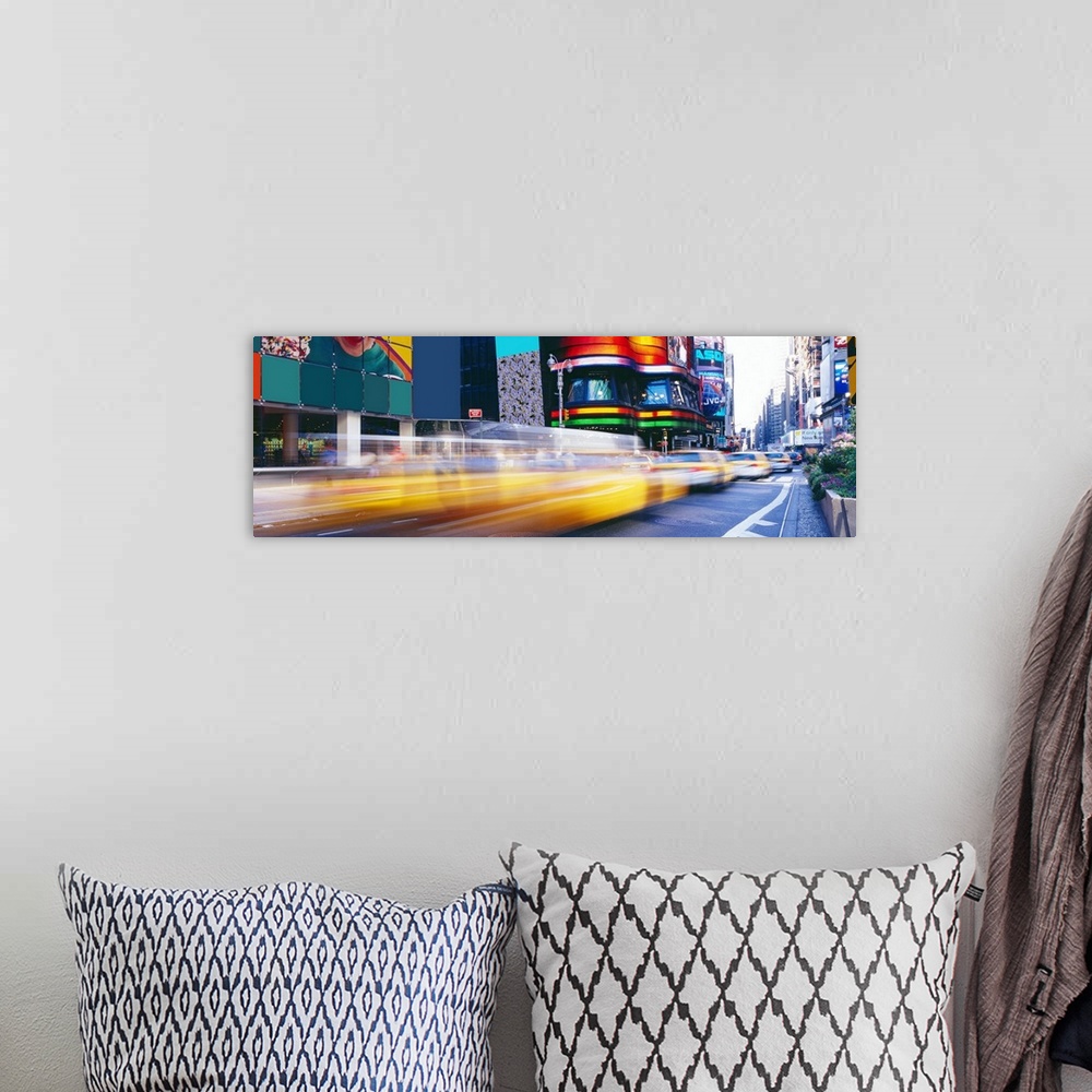 A bohemian room featuring Panorama of New York City's Times Square and fast paced yellow cabs.