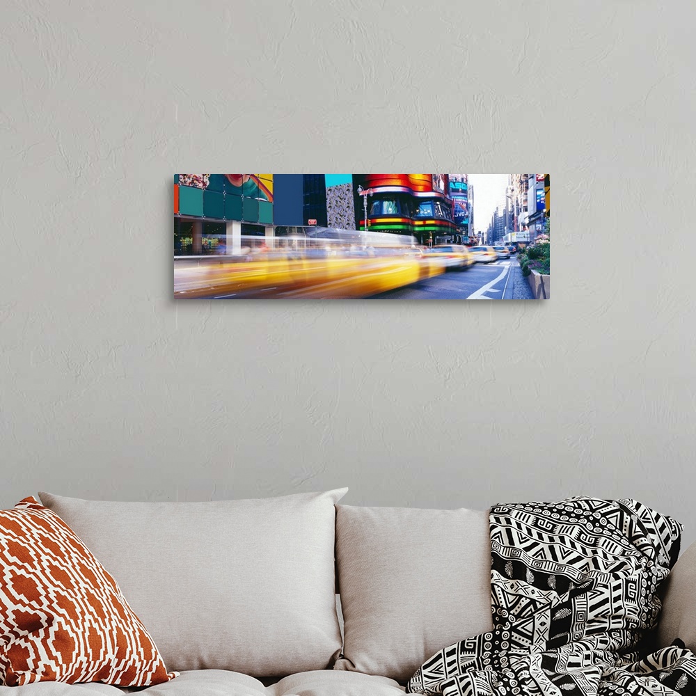 A bohemian room featuring Panorama of New York City's Times Square and fast paced yellow cabs.