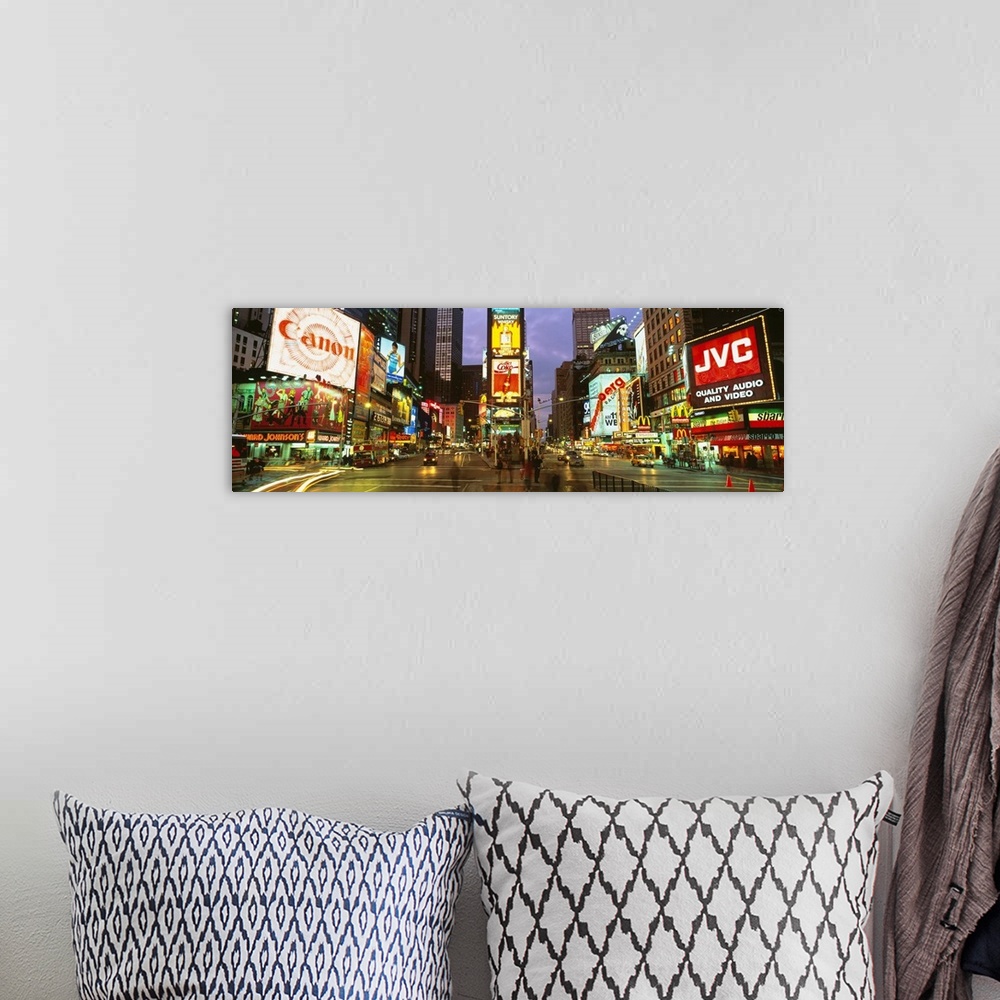 A bohemian room featuring Wide angle photograph of Times Square in New York City, lit at night, with billboards including C...