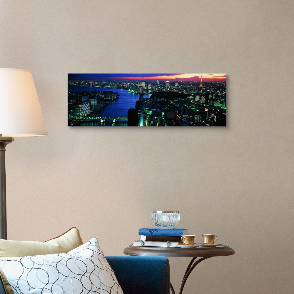 A traditional room featuring Panoramic photo on canvas of a lit up downtown cityscape with water flowing through it.