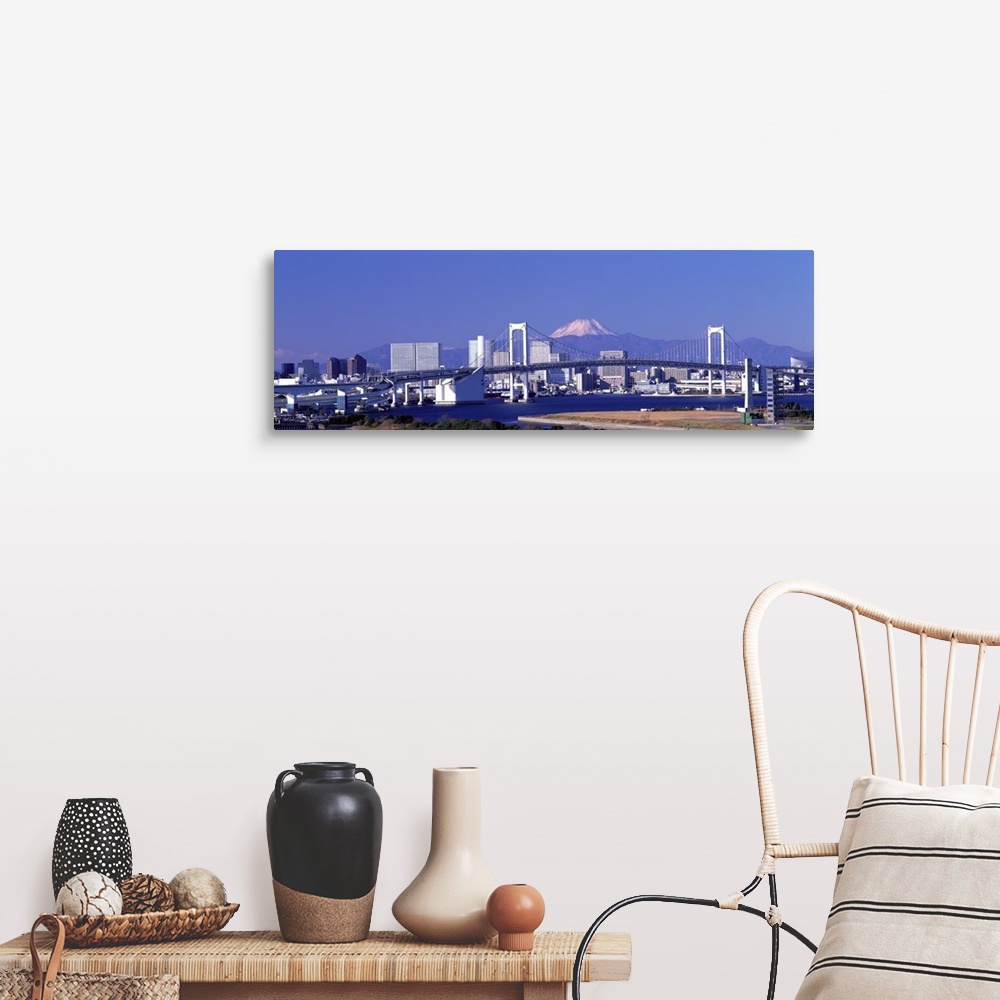 A farmhouse room featuring Large panoramic piece of the Tokyo skyline with a bridge and buildings in full view and a mountai...