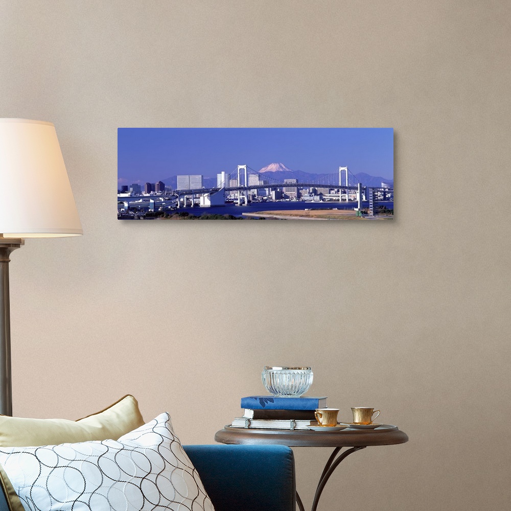 A traditional room featuring Large panoramic piece of the Tokyo skyline with a bridge and buildings in full view and a mountai...