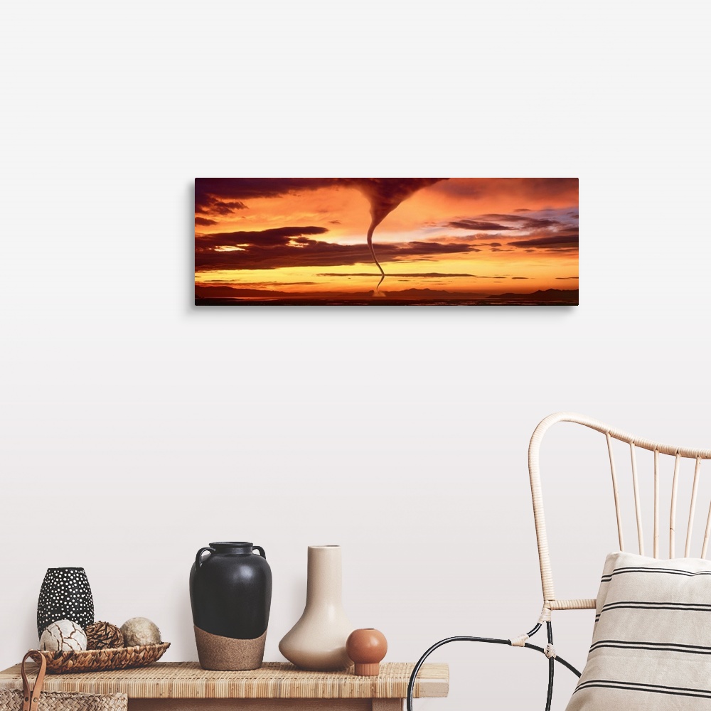 A farmhouse room featuring A large panoramic shot of a tornado touching down with a sunset sky stretching across the entire ...