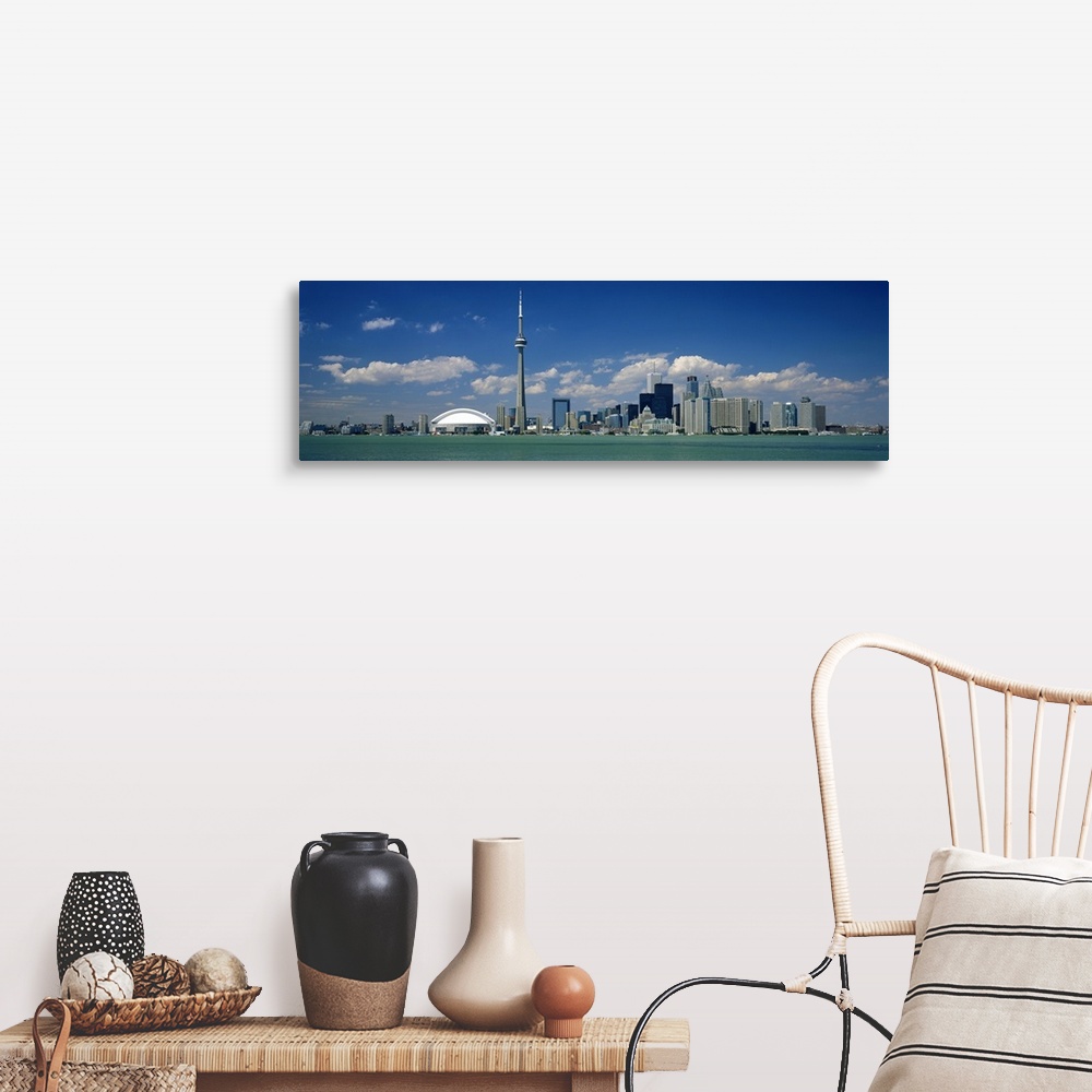 A farmhouse room featuring Wide angle photograph on a large canvas of the Ontario skyline, including the CN Tower, in front ...
