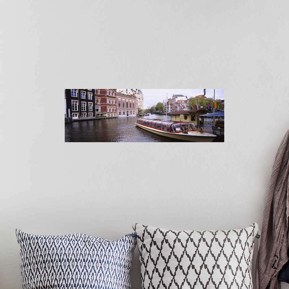 A bohemian room featuring Tourboat in a channel, Amsterdam, Netherlands