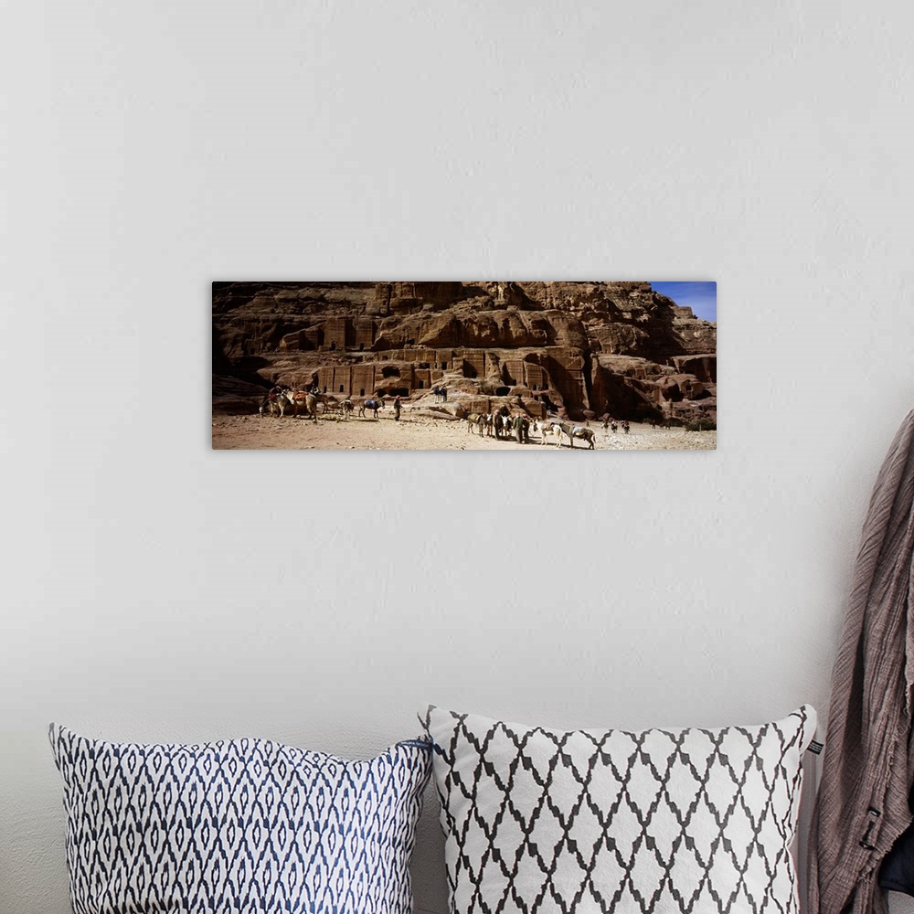 A bohemian room featuring Tourist at ancient structures, Petra, Jordan
