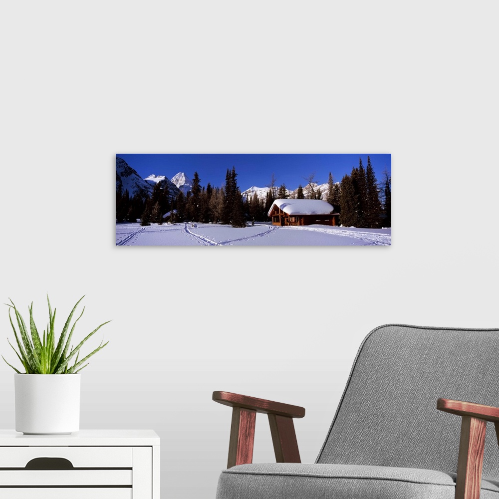 A modern room featuring Tourist lodge in a snow covered field, Naiset Cabins and Huts, Mt Assiniboine Provincial Park, Br...