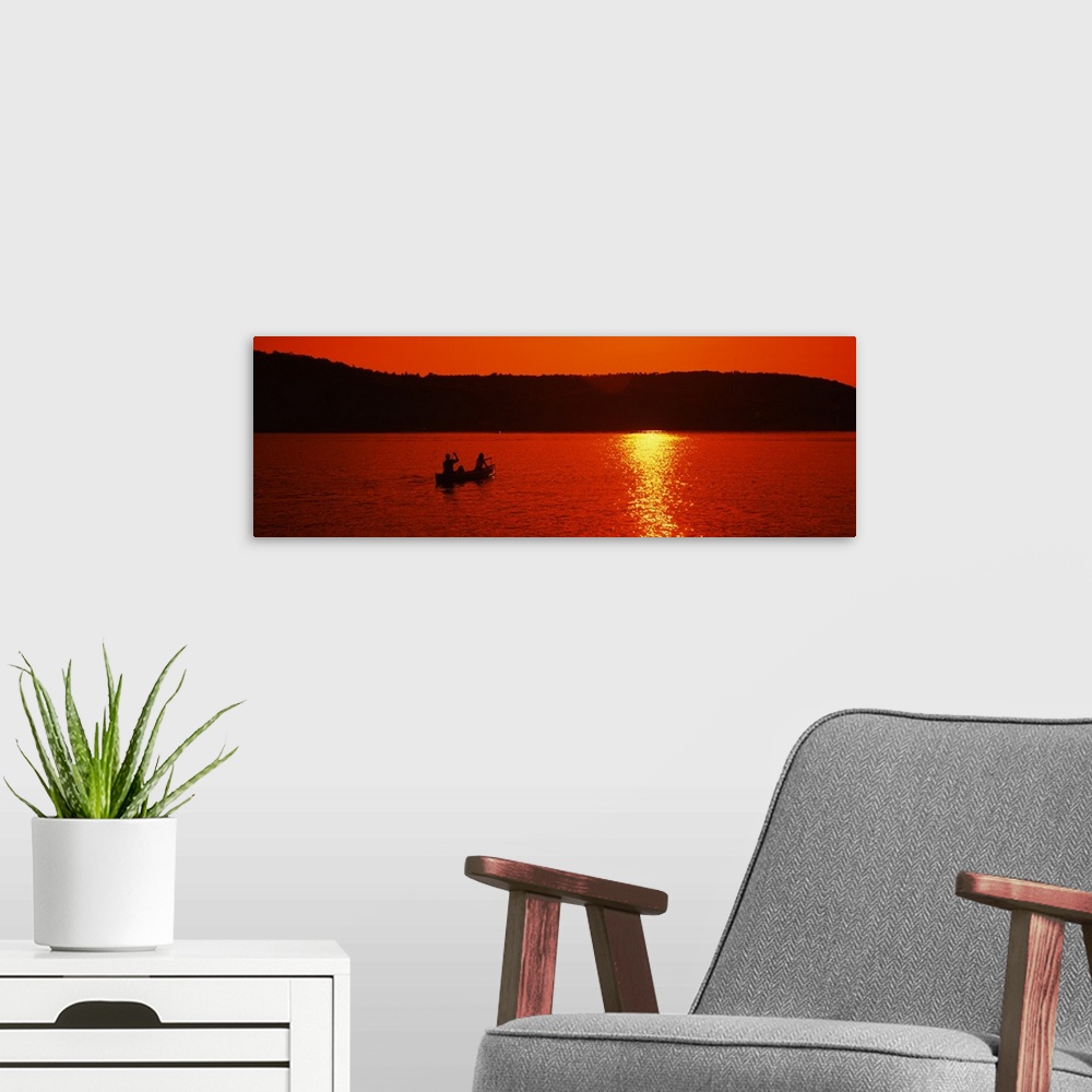 A modern room featuring Tourists canoeing in a lake at sunset, Oquaga Lake, Deposit, Broome County, New York State