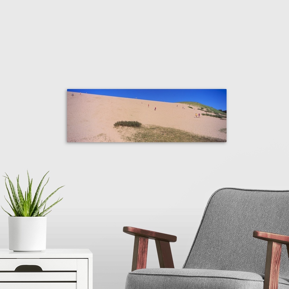 A modern room featuring Tourists climbing a sand dune, Sleeping Bear Dunes National Lakeshore, Lake Michigan, Michigan