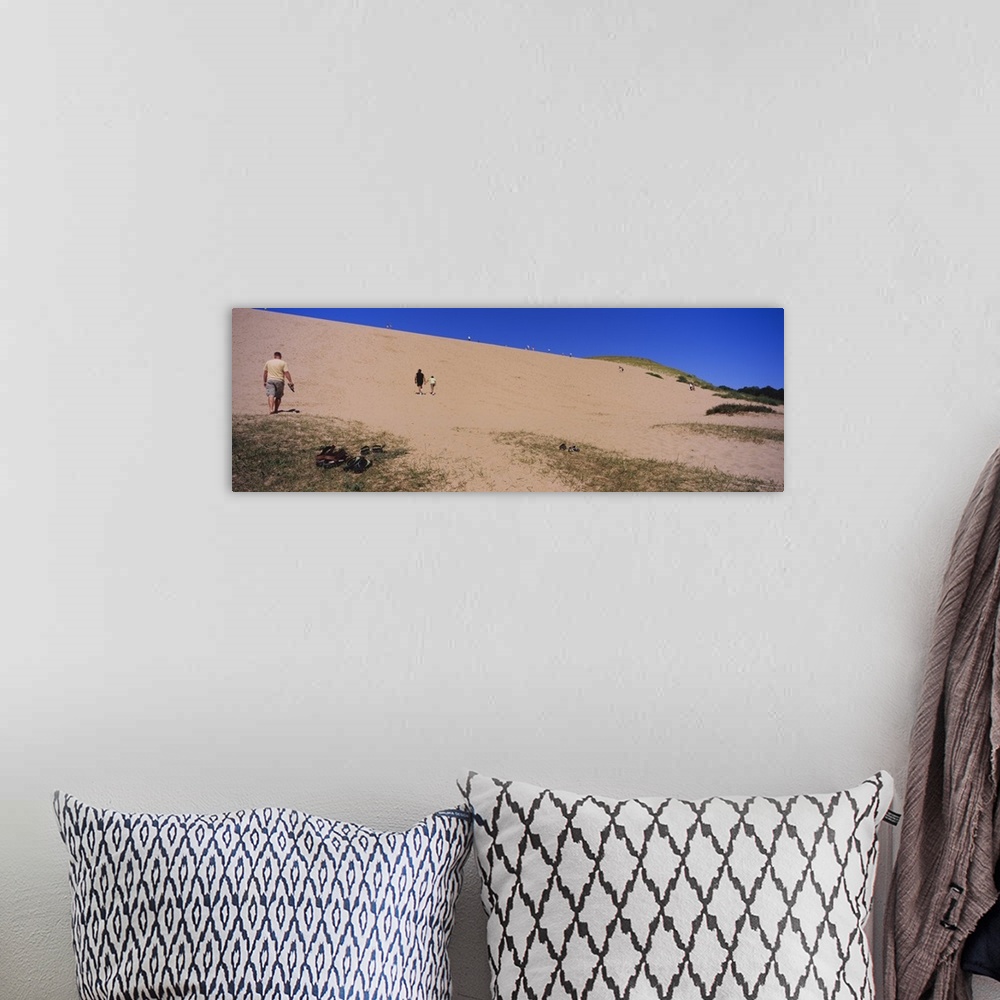 A bohemian room featuring Tourists climbing a sand dune, Sleeping Bear Dunes National Lakeshore, Lake Michigan, Michigan