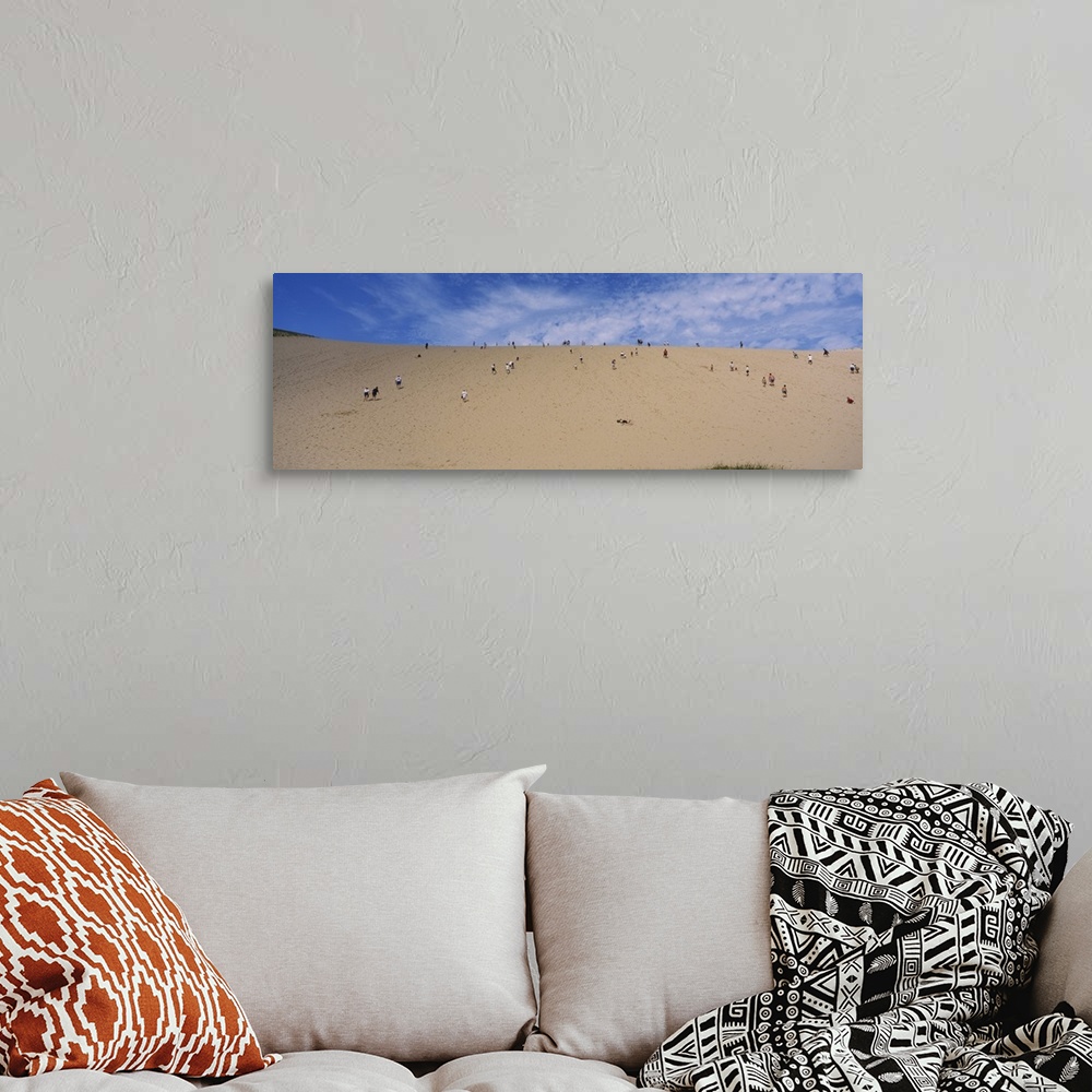 A bohemian room featuring Tourists climbing a sand dune, Sleeping Bear Dunes National Lakeshore, Michigan