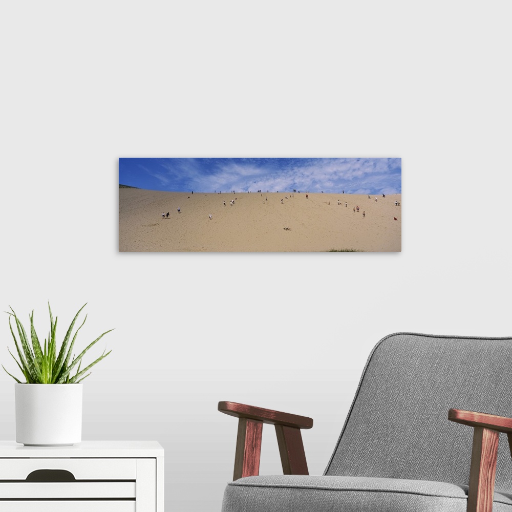 A modern room featuring Tourists climbing a sand dune, Sleeping Bear Dunes National Lakeshore, Michigan