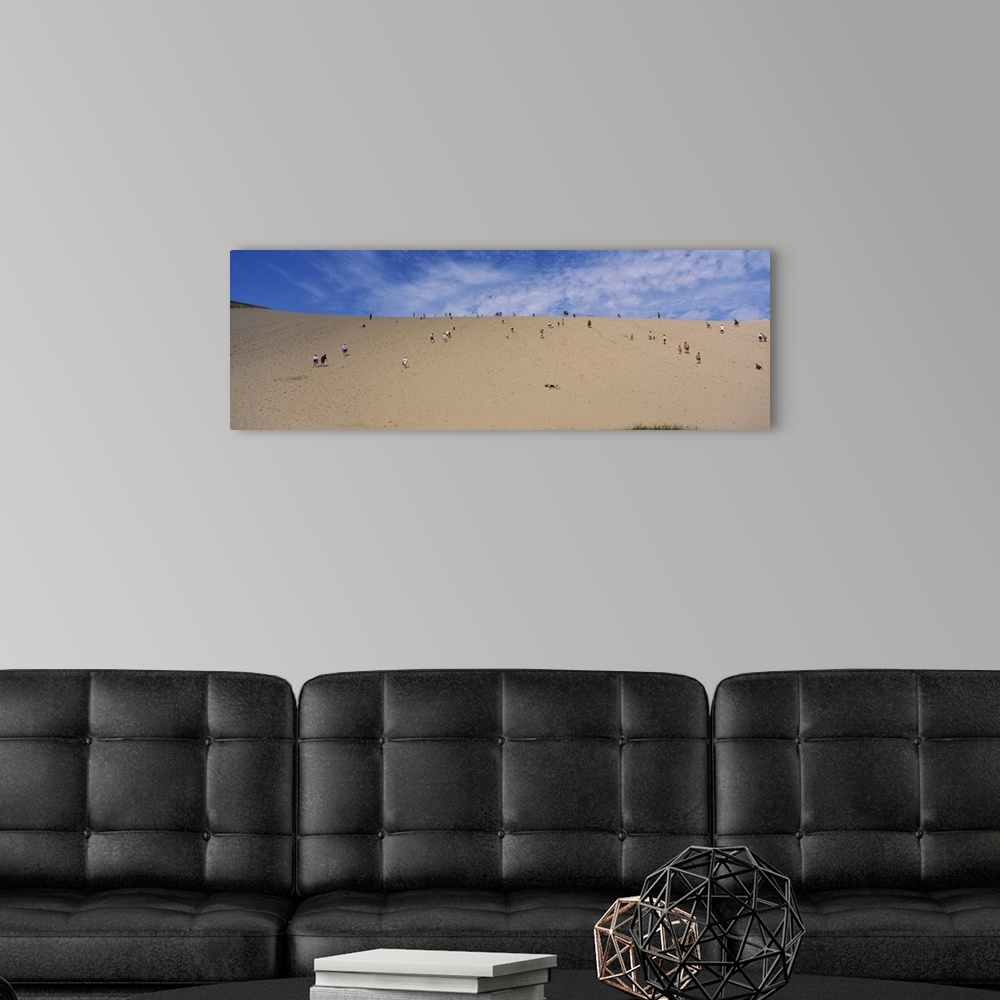 A modern room featuring Tourists climbing a sand dune, Sleeping Bear Dunes National Lakeshore, Michigan
