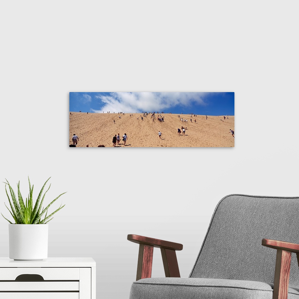 A modern room featuring Tourists climbing on sand dune, Sleeping Bear Dunes National Lakeshore, Lake Michigan, Michigan,