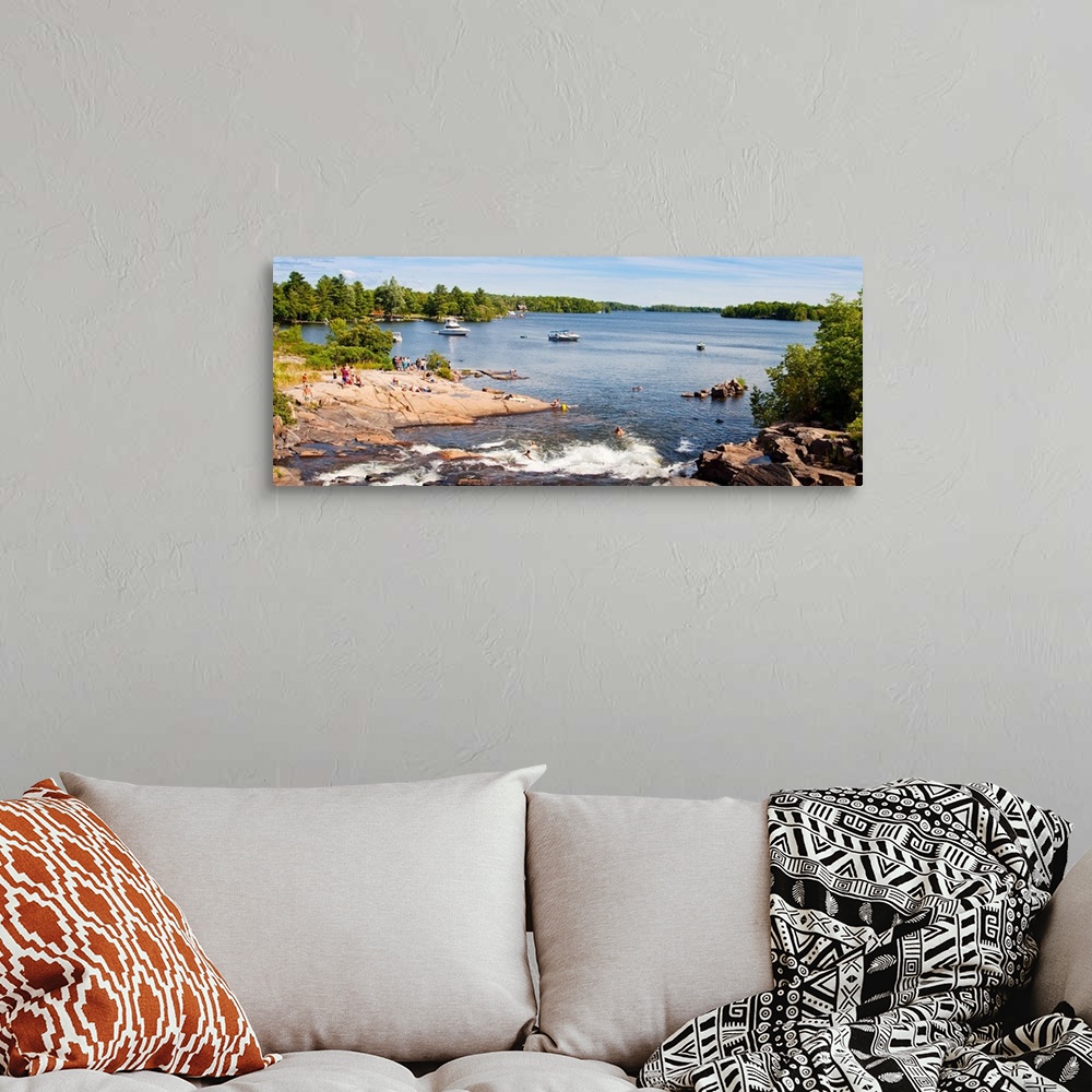 A bohemian room featuring Tourists enjoying at lakeside, Muskoka, Ontario, Canada
