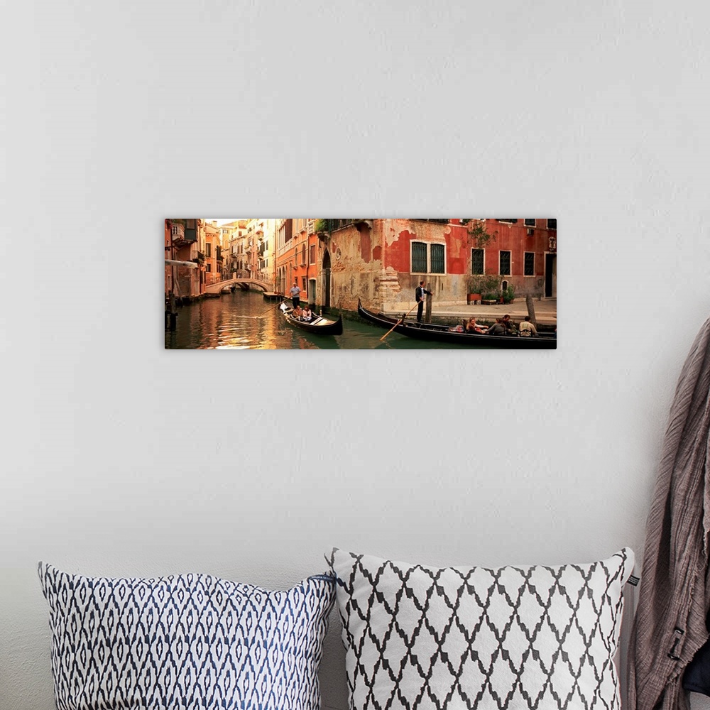A bohemian room featuring Gondolas paddling through canals lined with historic Venetian buildings.