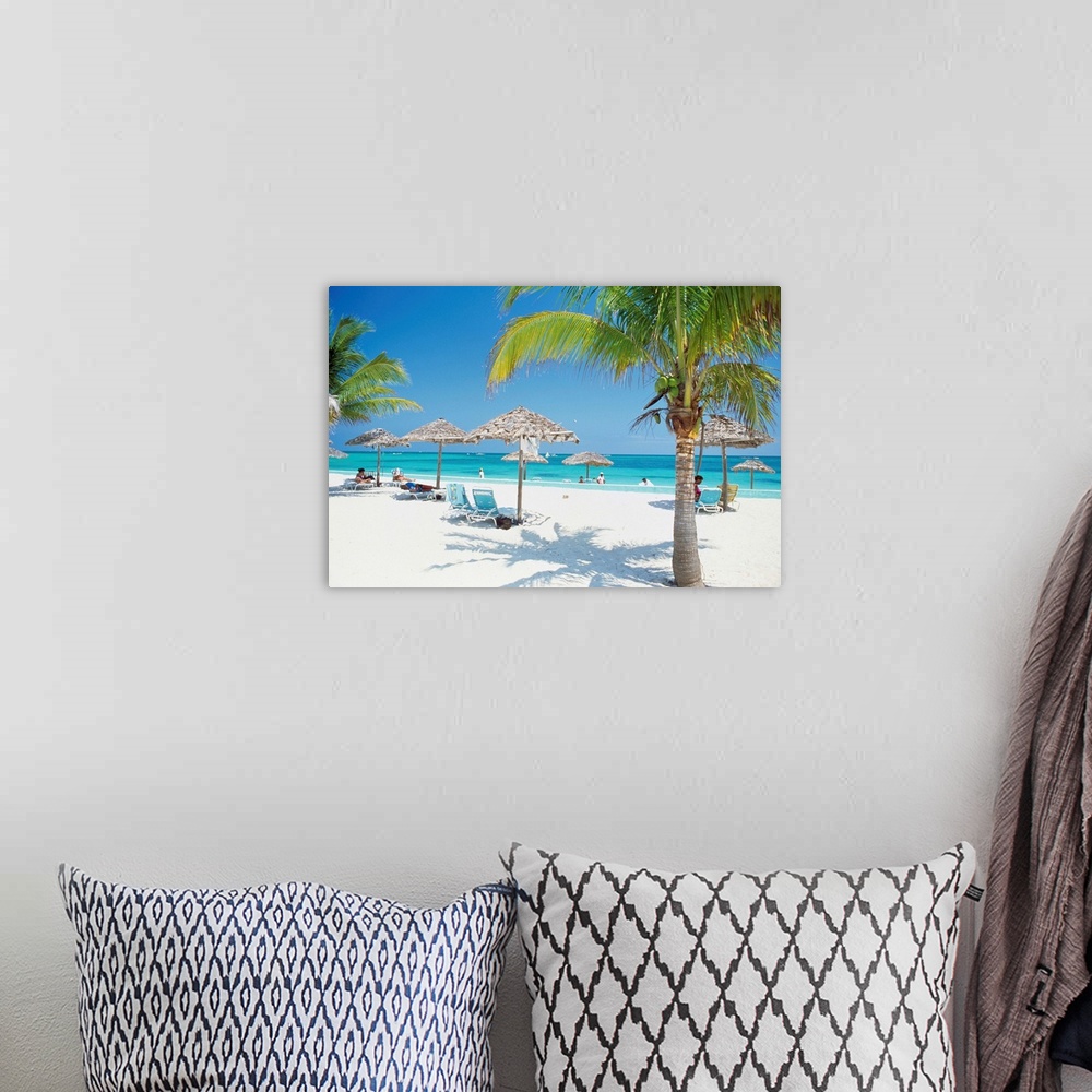 A bohemian room featuring Tourists on the beach