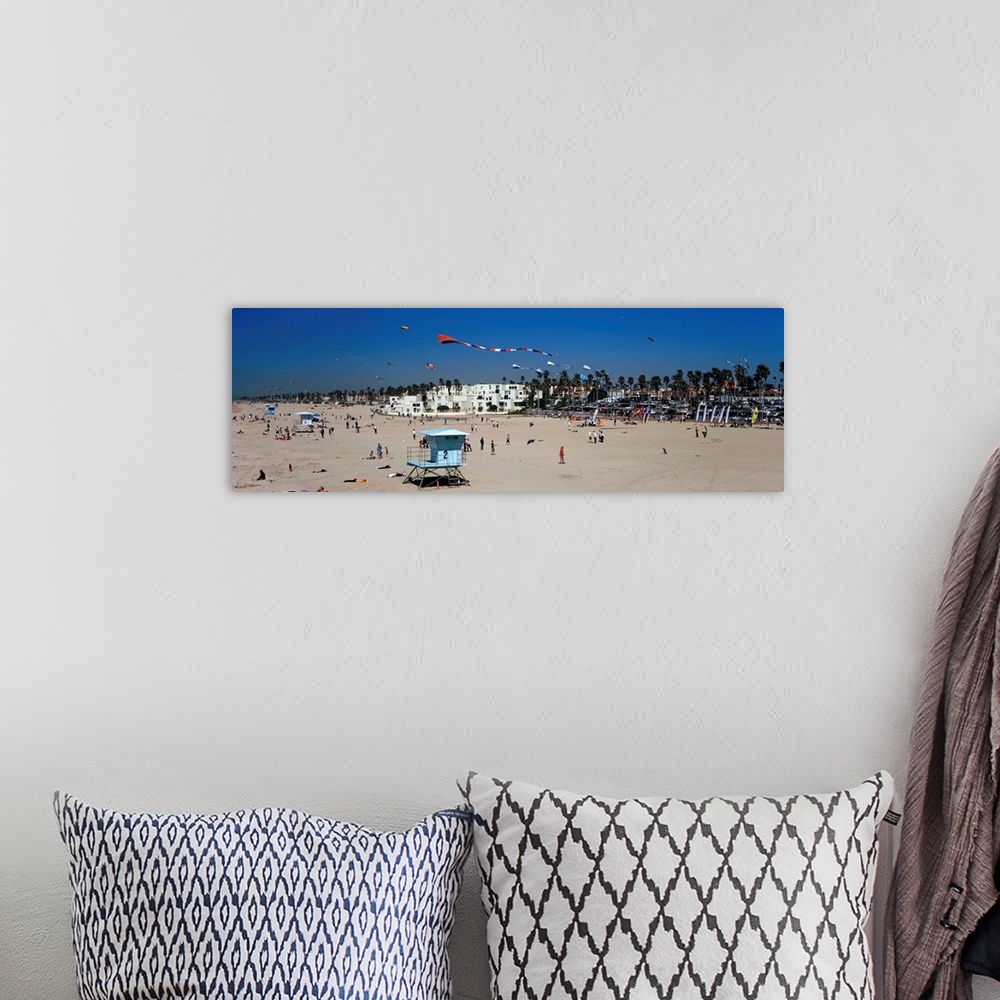 A bohemian room featuring Tourists on the beach Huntington Beach Orange County California