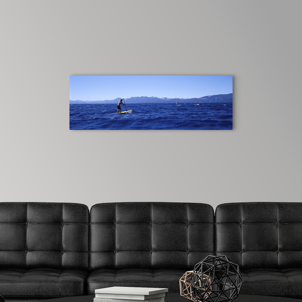 A modern room featuring Tourists paddle boarding in a lake, Lake Tahoe, California, USA