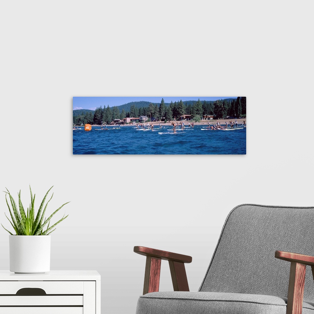 A modern room featuring Tourists paddle boarding in a lake, Lake Tahoe, California, USA