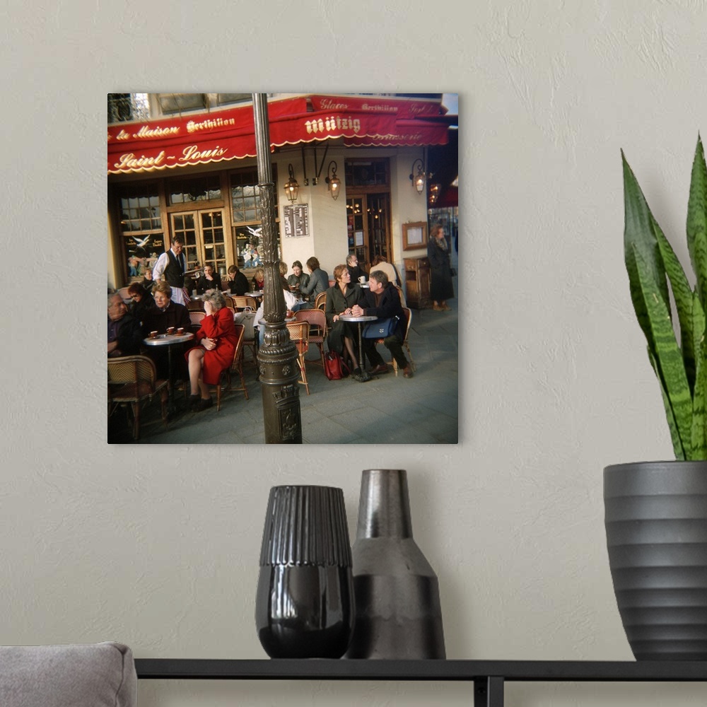 A modern room featuring Tourists sitting at a sidewalk cafe, Bistrot Ile St Louis, Paris, France