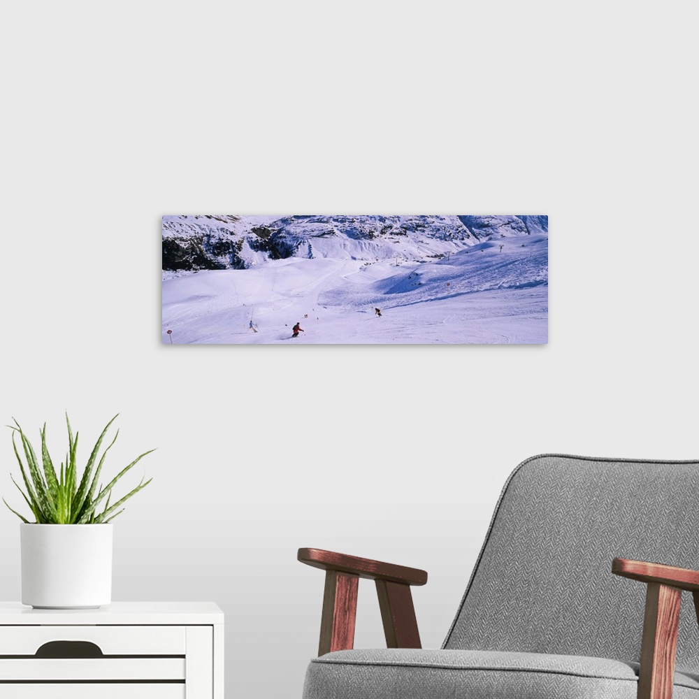 A modern room featuring Tourists skiing on snow, Zurs, Austria