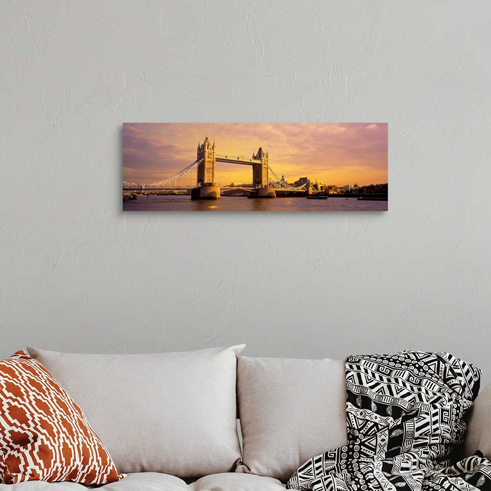 A bohemian room featuring A panoramic photograph of the bridge at sunset.