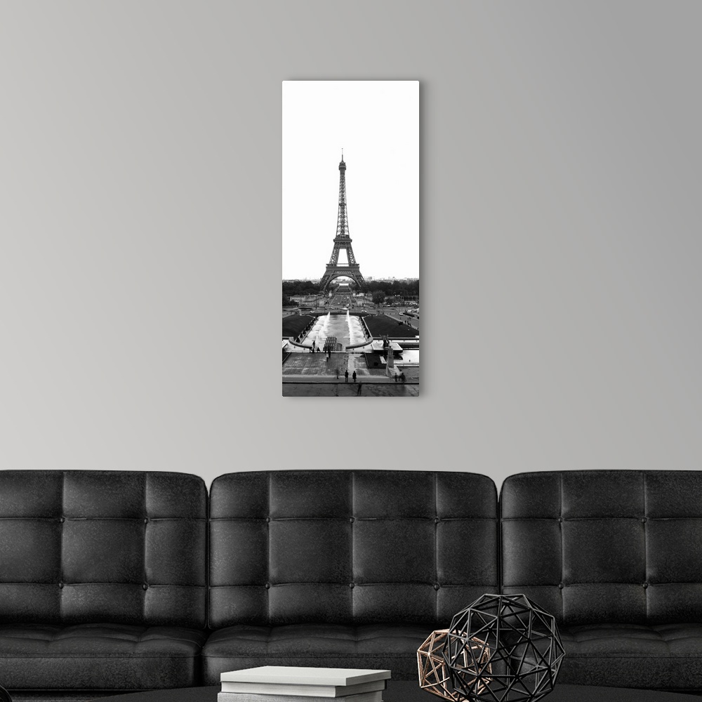 A modern room featuring Black and white photograph of the Eiffel Tower as seen from the edge of the plaza. The tower cont...