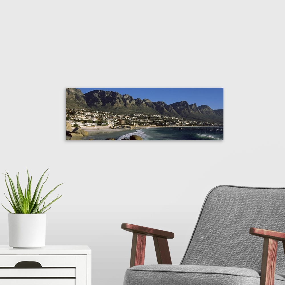 A modern room featuring Town at the coast with a mountain range in the background, Twelve Apostle, Camps Bay, Cape Town, ...