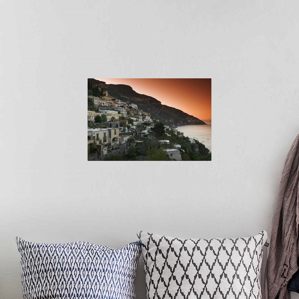 A bohemian room featuring Oversized, landscape photograph of several cities in Italy on a hillside at dusk, including Posit...