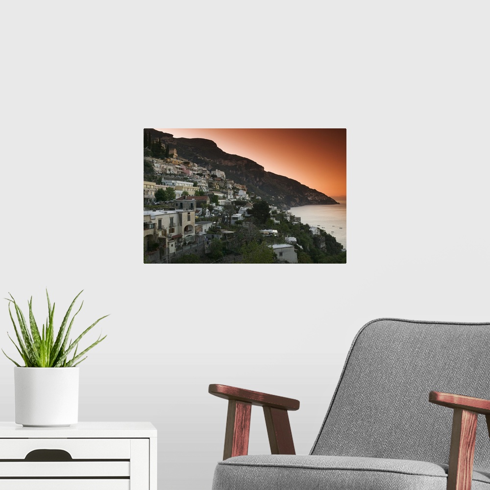 A modern room featuring Oversized, landscape photograph of several cities in Italy on a hillside at dusk, including Posit...