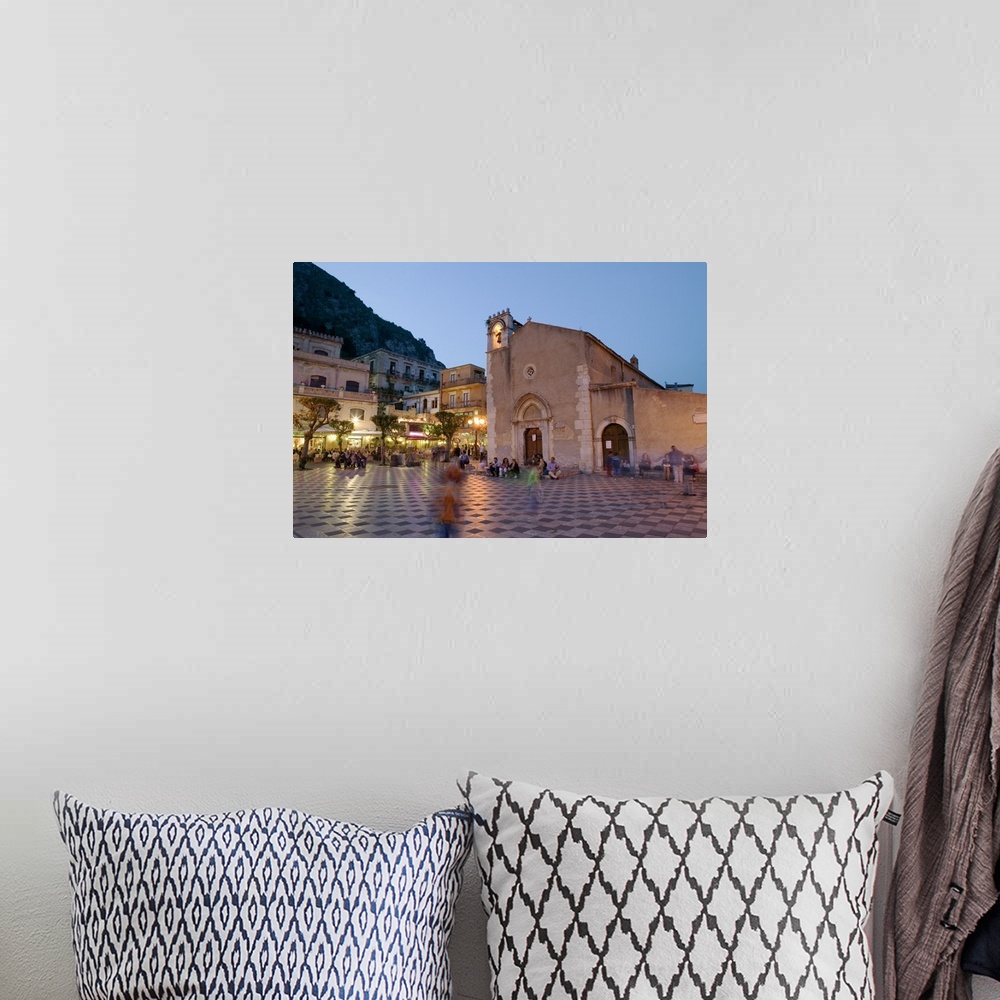 A bohemian room featuring Town square lit up at dusk, Piazza IX Aprile, Taormina, Sicily, Italy