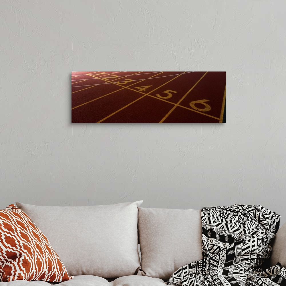 A bohemian room featuring Up-close panoramic photograph of track markings with lines and numbers designating lanes.