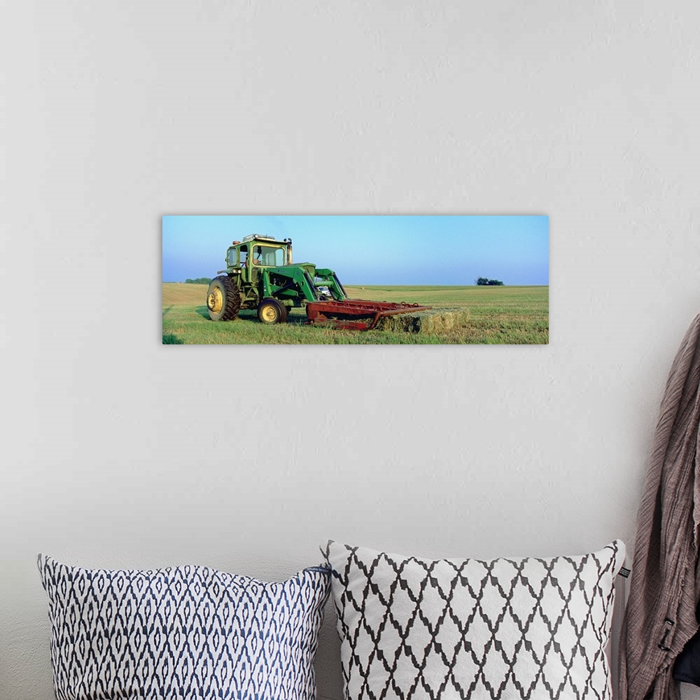 A bohemian room featuring Tractor in a hay field, Jackson County, Kansas