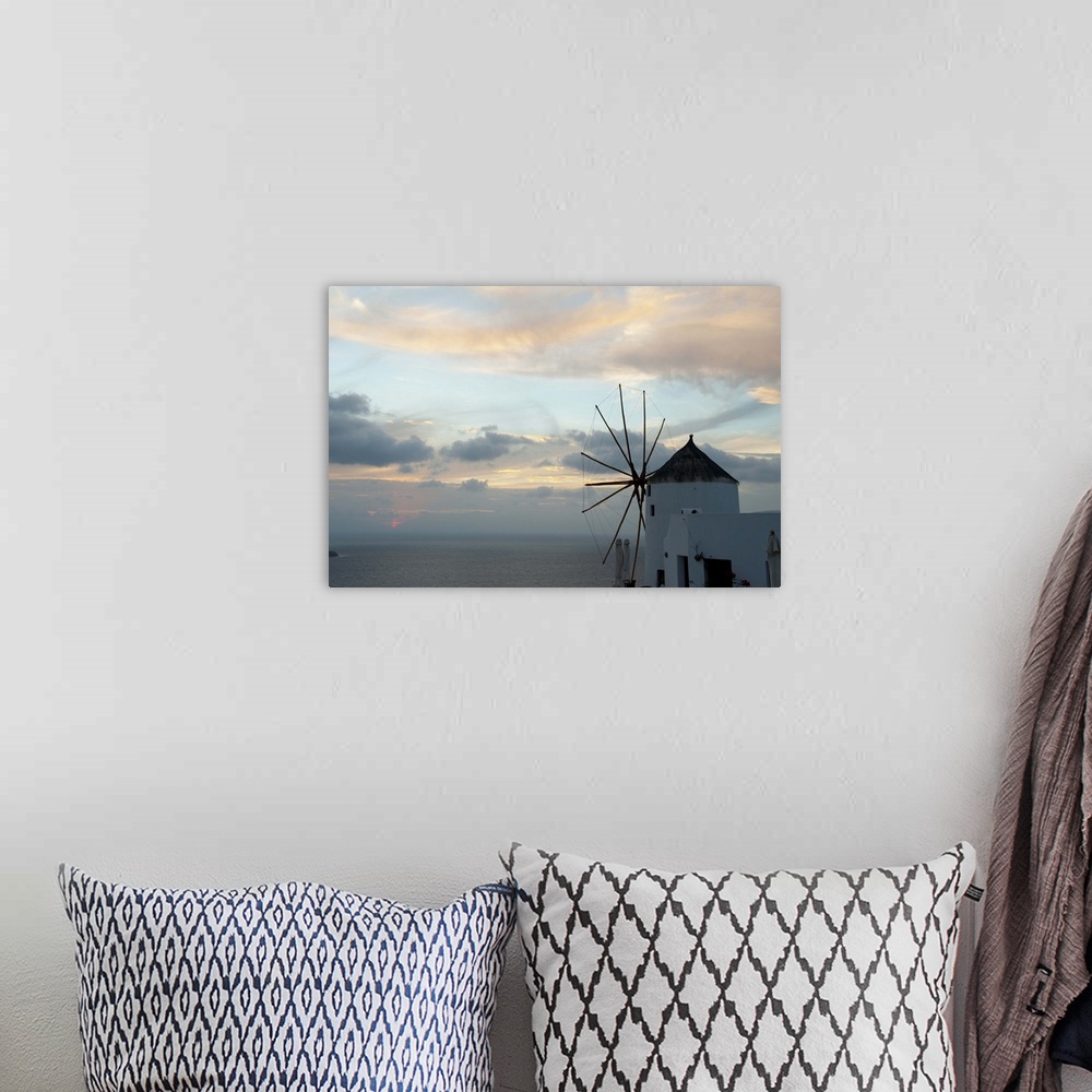 A bohemian room featuring Traditional windmill on the coast, Oia, Santorini, Cyclades Islands, Greece