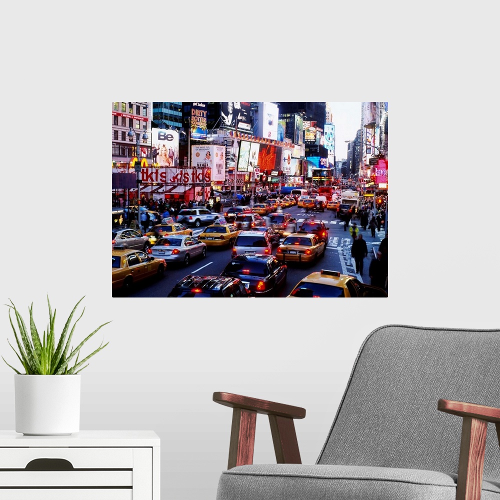 A modern room featuring A landscape photograph of the chaotic city traffic crowded with taxi cabs, personal vehicles, and...
