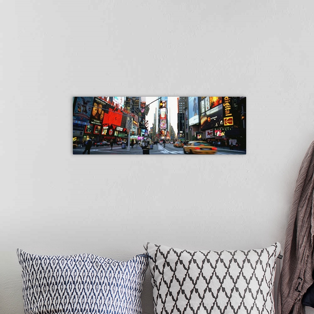 A bohemian room featuring Times Square, NYC with neon signs.